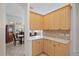 Eat-in kitchen with granite countertops and light wood cabinetry at 5584 Eastwind Dr, Sarasota, FL 34233