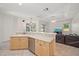 Bright eat-in kitchen features stainless steel appliances and lovely views of the backyard and living area at 5584 Eastwind Dr, Sarasota, FL 34233