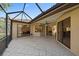 Spacious screened lanai with tile flooring and exterior home views at 5584 Eastwind Dr, Sarasota, FL 34233