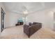 Bright living room boasting a ceiling fan, tile flooring, and comfortable seating at 5584 Eastwind Dr, Sarasota, FL 34233