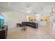Living room showcases tile floors, ceiling fan, and an open layout connecting to the kitchen at 5584 Eastwind Dr, Sarasota, FL 34233