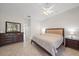 Spacious main bedroom featuring neutral tones, a ceiling fan, and stylish furniture at 5584 Eastwind Dr, Sarasota, FL 34233