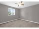 Neutral toned bedroom with window, carpeted floor and ceiling fan offering a calm, relaxing space at 5981 Willows Bridge Loop, Ellenton, FL 34222
