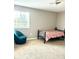 Bedroom features carpet floors and a window at 5981 Willows Bridge Loop, Ellenton, FL 34222