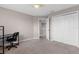 Bedroom featuring a ceiling fan, large window, and closet with double doors at 5981 Willows Bridge Loop, Ellenton, FL 34222