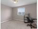 Bedroom with neutral walls, large window, ceiling fan, and a black desk at 5981 Willows Bridge Loop, Ellenton, FL 34222
