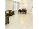 Spacious dining room featuring tile flooring and a table with four chairs at 5981 Willows Bridge Loop, Ellenton, FL 34222