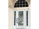 Elegant front door with decorative glass and sidelights, enhancing the home's entry at 5981 Willows Bridge Loop, Ellenton, FL 34222