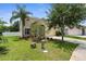 Charming single-Gathering home with a lush front yard and an attached two-car garage at 5981 Willows Bridge Loop, Ellenton, FL 34222