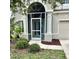 Charming home featuring a screened front porch and a well-maintained landscaped yard at 5981 Willows Bridge Loop, Ellenton, FL 34222