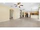Bright, open floor plan showcases tile flooring, staircase, and kitchen with breakfast bar at 5981 Willows Bridge Loop, Ellenton, FL 34222