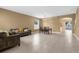 Open-concept living and dining area with tile flooring and ample natural light at 5981 Willows Bridge Loop, Ellenton, FL 34222