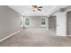 Spacious main bedroom featuring neutral paint, plush carpet, and tray ceiling at 5981 Willows Bridge Loop, Ellenton, FL 34222