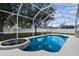 Screened-in pool, spa, and a backyard great for entertaining and relaxing at 5981 Willows Bridge Loop, Ellenton, FL 34222