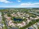 Scenic aerial view showcasing a lakefront community with manicured green spaces and charming residential architecture at 6101 34Th W St # 11C, Bradenton, FL 34210