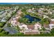 Panoramic aerial view of a community encircling a scenic lake, blending residential charm with natural beauty at 6101 34Th W St # 11C, Bradenton, FL 34210