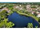 Stunning aerial view showcasing a lake surrounded by lush greenery and beautiful homes at 6101 34Th W St # 11C, Bradenton, FL 34210