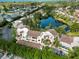 Overhead view of a residential complex with surrounding landscaping and a serene lake nearby at 6101 34Th W St # 11C, Bradenton, FL 34210