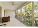 Spacious screened balcony overlooking a tranquil lake and mature trees at 6101 34Th W St # 11C, Bradenton, FL 34210