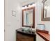 Modern bathroom featuring a glass vessel sink, wood-trimmed mirror, and contemporary vanity at 6101 34Th W St # 11C, Bradenton, FL 34210