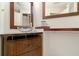 Contemporary bathroom showcasing a glass sink, modern fixtures, and stylish wood cabinet at 6101 34Th W St # 11C, Bradenton, FL 34210