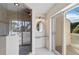 Bathroom featuring a glass shower and a sliding glass door leading to the balcony at 6101 34Th W St # 11C, Bradenton, FL 34210