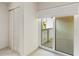 A bedroom with closet, a sliding glass door to a balcony, and tan carpet at 6101 34Th W St # 11C, Bradenton, FL 34210