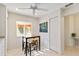 Breakfast nook features a ceiling fan, window, and a painting adding character to the space at 6101 34Th W St # 11C, Bradenton, FL 34210