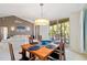 Dining room with dark wooden table and a view of the lanai at 6101 34Th W St # 11C, Bradenton, FL 34210