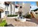Charming condo featuring brick pavers, a center courtyard with fountain, and red awnings at 6101 34Th W St # 11C, Bradenton, FL 34210