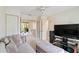 Spacious living room with modern décor, ceiling fan, and multiple access points to other living spaces at 6101 34Th W St # 11C, Bradenton, FL 34210