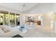 Open concept living room with sliding glass doors to screened in porch at 6101 34Th W St # 11C, Bradenton, FL 34210