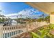 Stunning balcony view of the waterway, with seating, white railings, and glimpses of a pool below at 634 Key Royale Dr, Holmes Beach, FL 34217