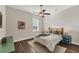 Cozy bedroom featuring a comfortable bed, a ceiling fan, and natural light at 634 Key Royale Dr, Holmes Beach, FL 34217
