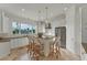 Modern kitchen featuring granite countertops, stainless steel appliances, and an island with bar seating at 634 Key Royale Dr, Holmes Beach, FL 34217
