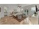 Bright main bedroom features balcony access, seating area and neutral color palette at 634 Key Royale Dr, Holmes Beach, FL 34217