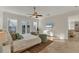 Bright main bedroom features balcony access, seating area and neutral color palette at 634 Key Royale Dr, Holmes Beach, FL 34217