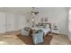 Bright main bedroom with ensuite bathroom, seating area, ceiling fan and neutral color palette at 634 Key Royale Dr, Holmes Beach, FL 34217