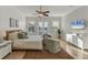 Main bedroom with ceiling fan, balcony access, and a neutral color palette at 634 Key Royale Dr, Holmes Beach, FL 34217