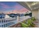 Relaxing outdoor patio featuring comfortable seating with beautiful views of the canal at 634 Key Royale Dr, Holmes Beach, FL 34217