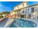 A serene pool and patio area features a spacious design, ideal for outdoor entertaining and relaxation at 634 Key Royale Dr, Holmes Beach, FL 34217