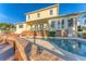 A serene pool and patio area features a spacious design, ideal for outdoor entertaining and relaxation at 634 Key Royale Dr, Holmes Beach, FL 34217