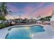 Sparkling pool with waterfront views, surrounded by lush landscaping perfect for outdoor enjoyment at 634 Key Royale Dr, Holmes Beach, FL 34217
