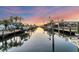 Scenic waterfront featuring docks, boats, and stunning sunset views perfect for boating enthusiasts at 634 Key Royale Dr, Holmes Beach, FL 34217