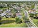 Aerial view of a suburban neighborhood featuring homes with private pools and lush landscaping at 6405 Alesheba Ln, Sarasota, FL 34240