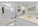 Clean bathroom featuring a shower-tub combo, single sink vanity, and neutral-toned decor at 6405 Alesheba Ln, Sarasota, FL 34240