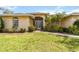 Charming single-story home with a well-manicured lawn and lush landscaping at 6405 Alesheba Ln, Sarasota, FL 34240