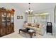 Cozy living room featuring a decorative couch, a coffee table, and a window with natural light at 6405 Alesheba Ln, Sarasota, FL 34240
