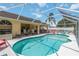 Sparkling screened-in pool and patio area is perfect for entertaining and enjoying the outdoors at 6405 Alesheba Ln, Sarasota, FL 34240