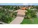 Aerial view of a lovely home with mature landscaping, brick driveway and a spacious two-car garage at 6528 Coopers Hawk Ct, Lakewood Ranch, FL 34202